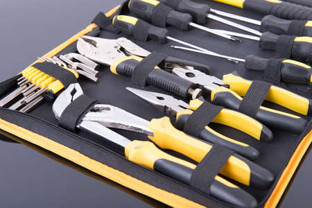 Toolkit black and yellow on black tableの写真素材