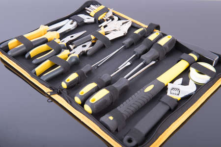 Toolkit black and yellow on black table