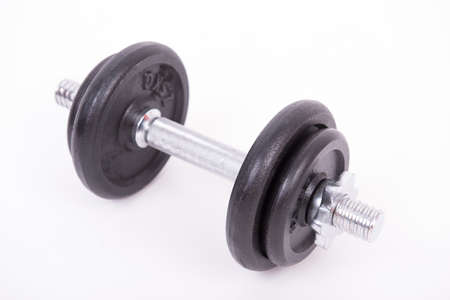 Heavy black and silver dumbbell on white backgroundの写真素材