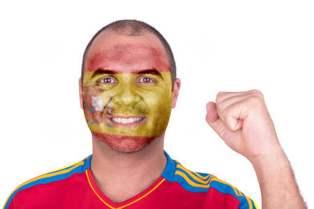 Man with Spain flag painted on her face on white backgroundの写真素材