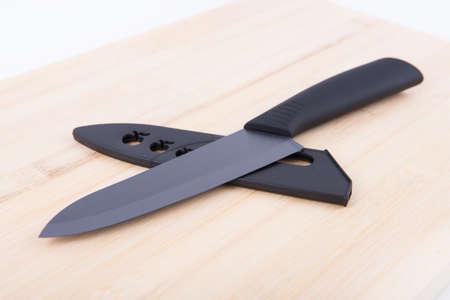 Black Knife on a cutting boardの写真素材