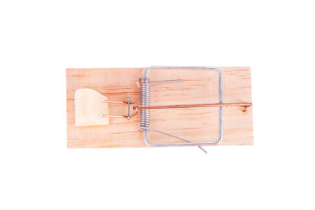 Wooden mousetrap with a piece of cheese on white backgroundの写真素材