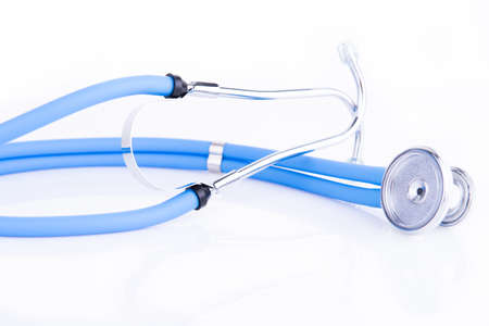 Blue stethoscope on a reflective white backgroundの写真素材