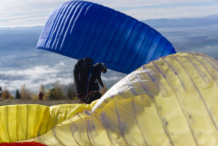 Paraglider flying in the blue sky, Parachuteの写真素材