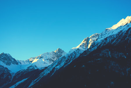 Beautiful mountain landscape with snow-capped peaks and blue sky in SÃ¶lden Austria