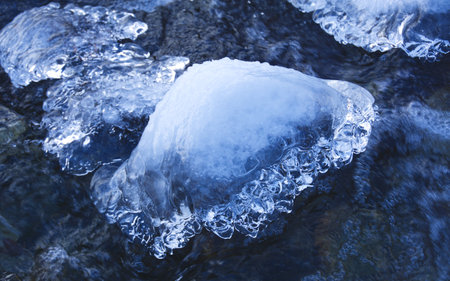 Close up of a piece of ice on the river in winter. Hlinsky Mengusovska Dolina Vysoke Tatry Hiking