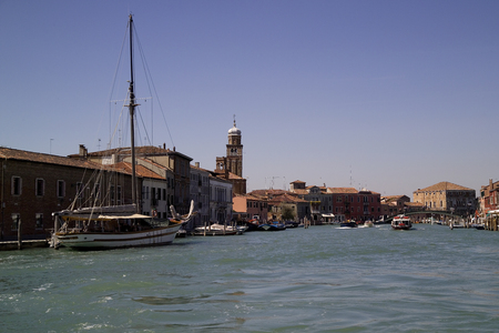 View of the Great channel of Murano Island with a sailing boat, Italyの写真素材