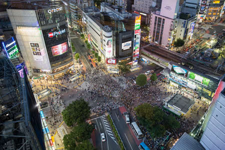 Tokyo, Japan; June 06 2016: Tokyo shibuya crossing crowded with people during dusk