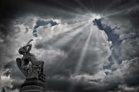 The Fountain of the Fallen Angel (Fuente del Angel Caido) or Monument of the Fallen Angel, a highlight of the Buen Retiro Park in Madrid, Spain.の写真素材