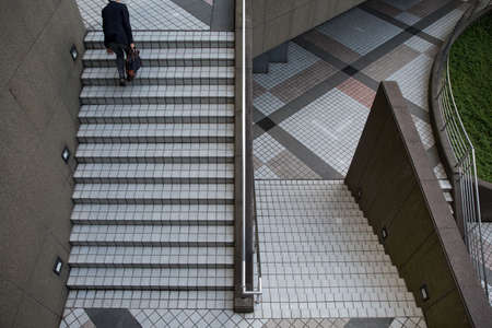 Business man. A solitary business man walking on his way to the office shortly after rush hour.のeditorial素材