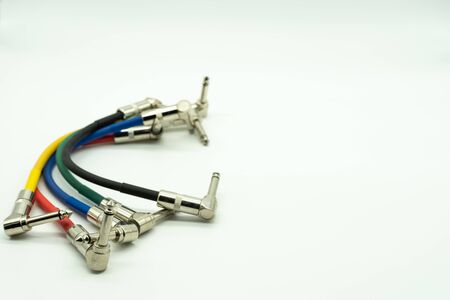 6.35 mm colored male to male jack cables isolated white background, music concept