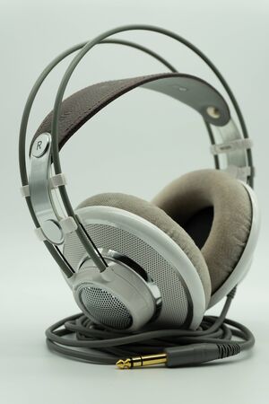 White and silver studio headphones for music producers. Mixing. On a white isolated background. Music Conceptの写真素材