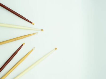 Top view of drumsticks on the left of the image on a white background , with space to the right of the image for text Concept of musical instruments.の写真素材