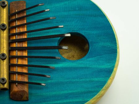 Top view of blue African kalimba on a white background. Traditional music concept.の写真素材