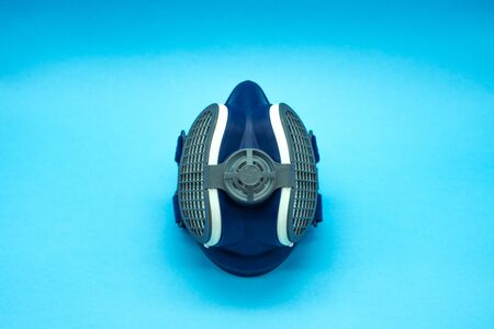 Coronavirus mask isolated in a blue background located in the center of the image. Concept virus. Covid-19.の写真素材