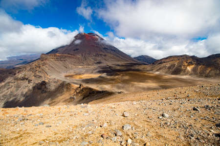 Scenic view on Mount Doom (Mount Ngauruhoe) surrounded by clouds from Red Crater in Tongariro Nation Park, New Zealand, North Islandの写真素材