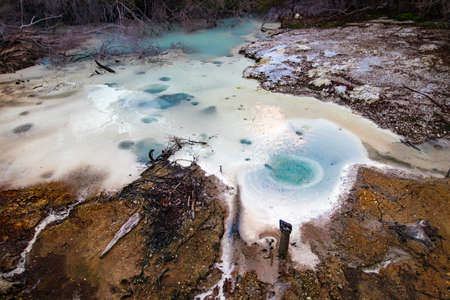 Beautiful colorful thermal mineral boiling pond discovered off beaten track near Wai o tapu,...