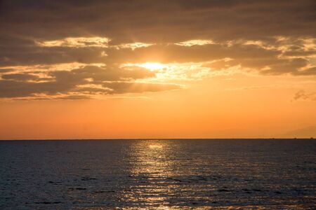 Golden sunset in mediterranean seaの写真素材