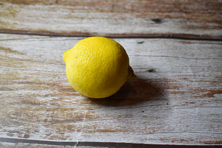 Lemon isolated on wooden desk.の写真素材