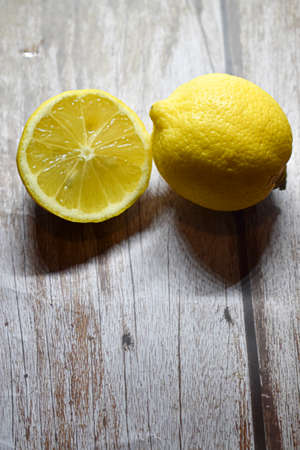 Lemons on wooden backgroundの写真素材