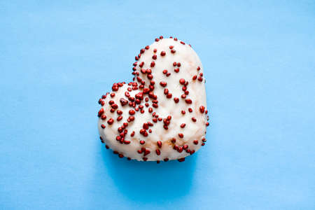 Baked heart isolated on blue background