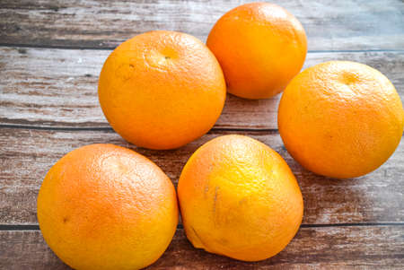 Grapefruits isolated on wooden backgroundの写真素材