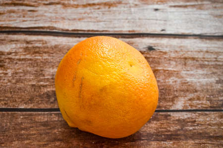 Grapefruit isolated on wooden deskの写真素材