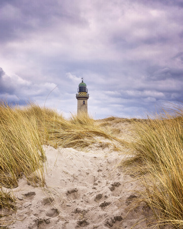 Footprints in the dune sand at the lighthouse in Warnemnde.の写真素材