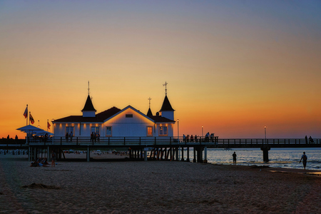 Ahlbeck pier in sunset with orange sky. Germanyの写真素材
