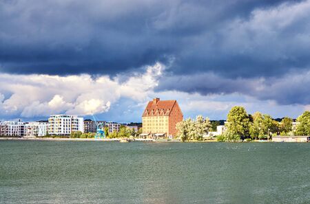 Dramatic clouds over the lake and the city of Schwerin. Mecklenburg-Vorpommern, Germanyの写真素材