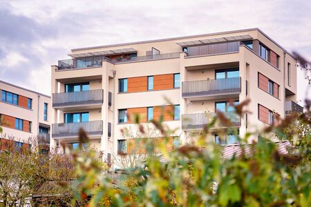 Modern residential building with outdoor facilities in Schwerin. Facade of new low-energy houses.の写真素材