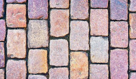 Cobblestone street as a stone background.