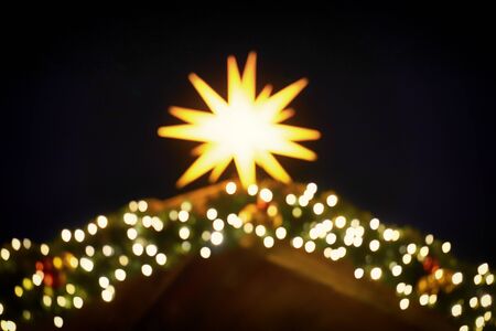 Blurred round bright lens effects from a brilliant christmas star. As a Christmas decoration.