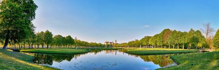 Panoramic view of the castle garden with lake and the Schwerin castle in the background.の写真素材