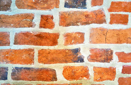 Close up of red aged brick wall as abstract background texture with old and vintage style pattern.の写真素材