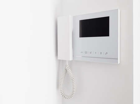 intercom on white wall with a three-quarter viewの写真素材