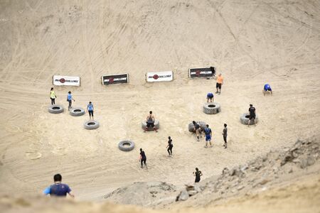 LIMA, PERU - OCTOBER 23, 2016: Inka Challenge, an extreme obstacle course where 1500 athletes from different countries managed to cross the finish line at Santa Maria beach.のeditorial素材