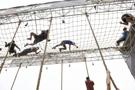 LIMA, PERU - OCTOBER 23, 2016: Inka Challenge, an extreme obstacle course where 1500 athletes from different countries managed to cross the finish line at Santa Maria beach.のeditorial素材