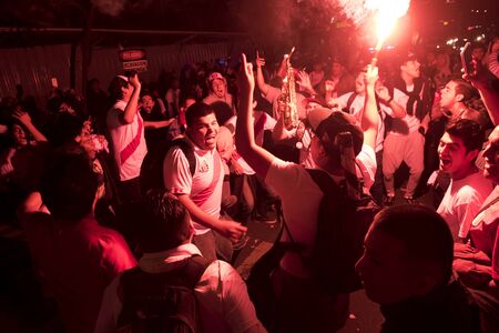 Lima, Peru - OCTOBER 12 2018: Fanaticism in Peru Peru vs. Chile Soccer. The Peruvian bar encouraging through the streets of Miraflores.のeditorial素材