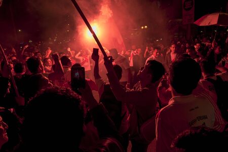 Lima, Peru - OCTOBER 12 2018: Fanaticism in Peru Peru vs. Chile Soccer. The Peruvian bar encouraging through the streets of Miraflores.のeditorial素材
