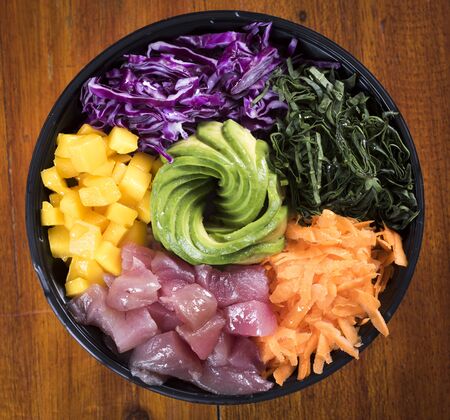Salmon poke with avocado, seaweed, pickled carrots and cucumber. Niceの写真素材