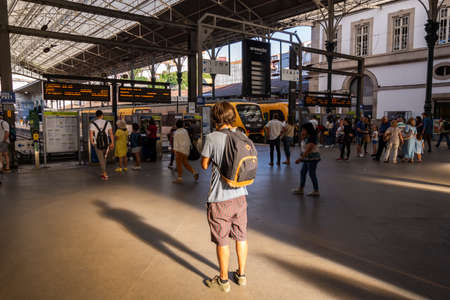 Man wating for the train in Sao Bento train station, Porto, Portugal.の写真素材