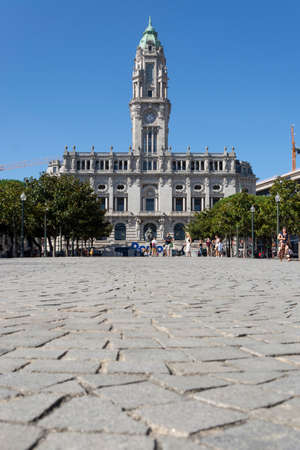 Porto City Hall with people walking. Sidewalkin the foregroundの写真素材
