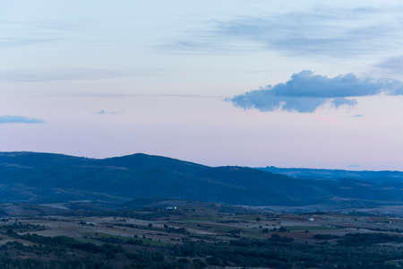 Sunset in the mountains. Clouds in the skyの写真素材