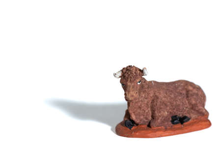 Christmas crib porcelain cow, white backgroundの写真素材