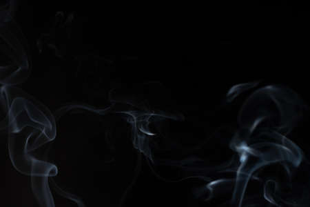 White smoke in a black backgroundの写真素材