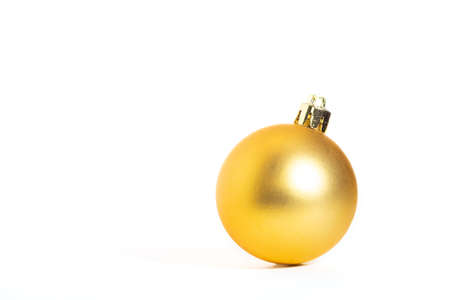 Golden Christmas ball, white backgroundの写真素材
