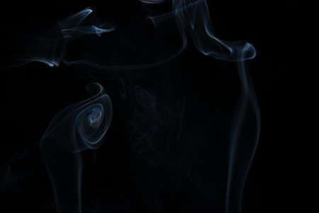 White smoke in a black backgroundの写真素材