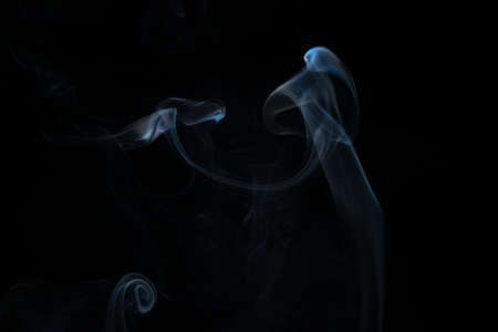 White smoke in a black backgroundの写真素材