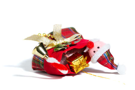 Christmas Santa Clouds with a golden present, white backgroundの写真素材